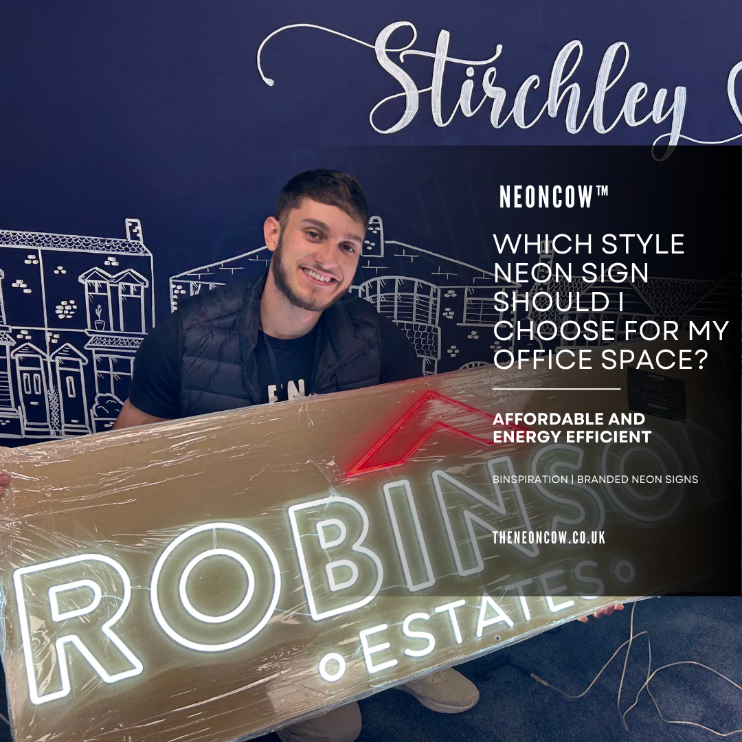 office space neon sign with a feature wall. Jack Quddus is holding a neon sign.