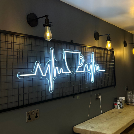 Ice white neon coffee decor sign in a Birmingham coffee shop, adding a stylish and modern touch to the café's atmosphere